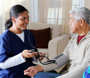 CNA Taking Patients Blood Pressure
