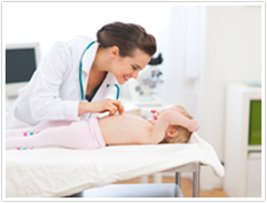 Home Health Aide Examining a Child